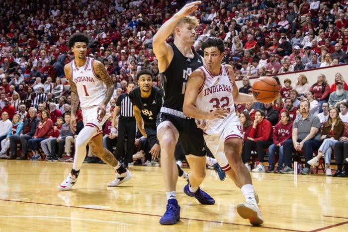 Indiana Hoosiers guard Trey Galloway (32) dribbles against North Alabama Lions center Eoin Nelson (15) defends in the first half at Simon Skjodt Assembly Hall.